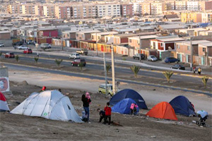 People camping in tents. Almost 1 million people have been evacuated. Credit: Caritas Chile