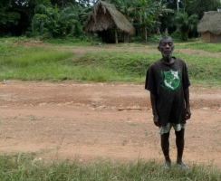 Charles Rennie has single handedly buried 38 friends, family and neighbours in the village of Bella Kartala in Bong County without protective gear. He now faces stigma. Credit: Caritas