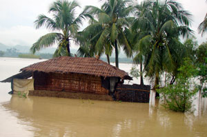 A house submerged in water in Satkania, Bangladesh Credits: Caritas