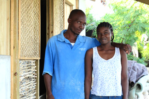 A couple in front of their new house built with the support of Caritas Austria. Credits: Caritas