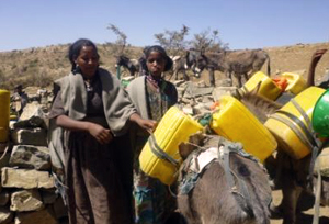 Villagers fetch water from a water point constructed through a Caritas cash for work program. Credits: Caritas Ethiopia