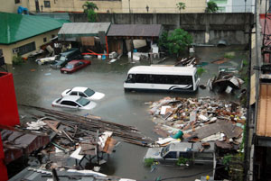 Damaged vehicles submerged in water after flash floods caused by Typhoon Ondoy hit the Philippines Credits: Caritas Manila