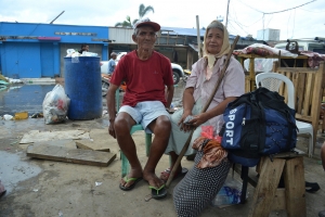 Gerardo Amantillo (74) and Jovita Amantillo (74) survived by clinging onto the roof of a neighbours house. They are photographed at Ormoc pier, where they were queuing for over 30 hours to get a boat off Leyte island. (Photo: Eoghan Rice - Trócaire / Caritas)