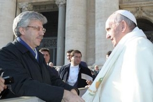 Caritas Internationalis Secretary General Michel Roy with Pope Francis. The pope is sporting a scarf from the Caritas One Human Family, Food for All Campaign.  