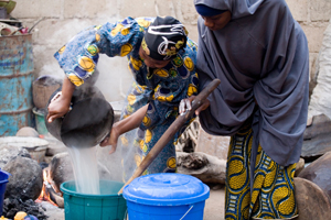 Caritas strives for better economic and social conditions at every migrant's home country, so that emigration will not be the only option left. Here women in Nigeria benefit from a constant supply of water from rainwater catchment tank  provided by CAFOD partner. Credit: CAFOD