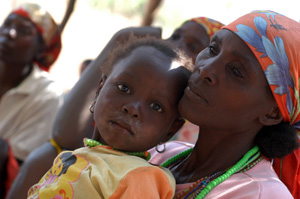 Residents of the Caipumba community in the Capupa commune listen to a seminar on HIV/AIDS conducted as part of a CRS-supported Caritas Benguela HIV/AIDS Seminar Project