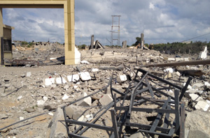 Buildings destroyed in Gaza where people are left with no running water (July 2014). Credit: Caritas Jerusalem