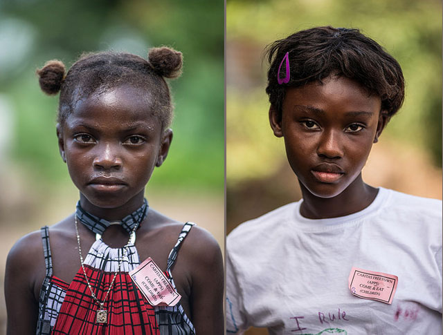 Juliana Ansumana (L), who does not know her age, lost both her parents to Ebola in a village near Potoru in Southeastern Sierra Leone. Katherine Keili(R), 12, lost both of her parents to Ebola in the village of Bumpeh.Sierra Leone. Photo by Tommy Trenchard for Caritas