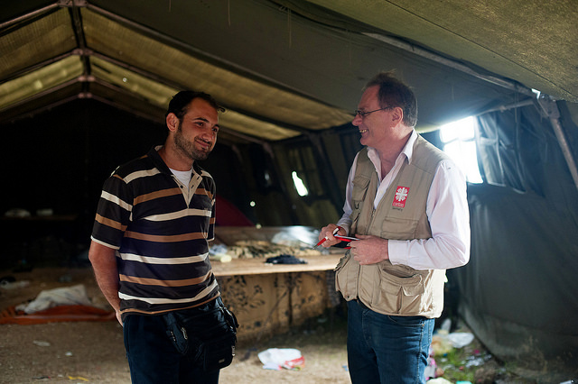 Abdalkarim Zahra, from Syria, is interviewed by Caritas Germany Communications Officer, Stefan Teplan, at Vasariste, a refugee aid point, in Kanjiza, Serbia. Photos by Kira Horvath for Catholic Relief Services