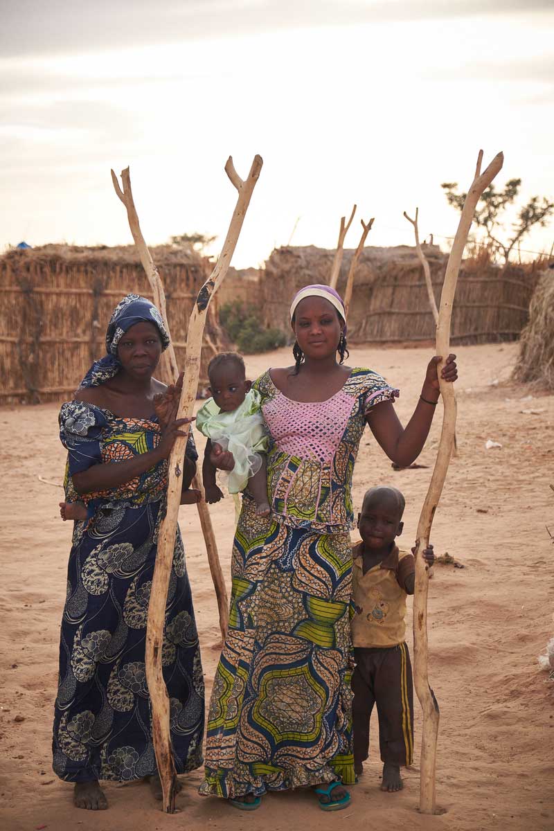 Zana and Adama with their children at camp of displaced people in the neighbourhood of Chateau, Diffa, Niger on February 13, 2016. Photo by Sam Phelps/Caritas