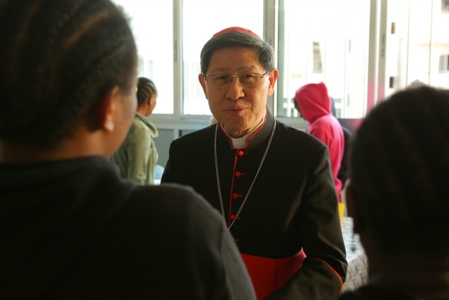 Cardinal Luis Tagle, president of Caritas Internationalis, met with trafficking survivors from Africa earlier in the year on a visit to the Middle East. Credit: Caritas