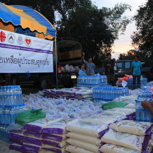 Monks, punks and priests help Thailand after floods