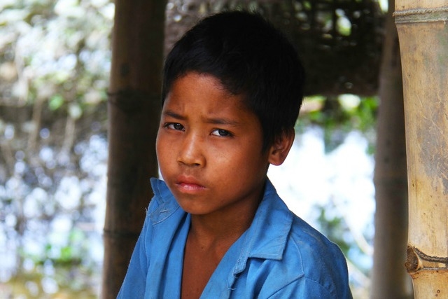 Basanta Norah an eight year old orphan, survived terrible flooding in India. His school was badly damaged, Credit: Caritas India