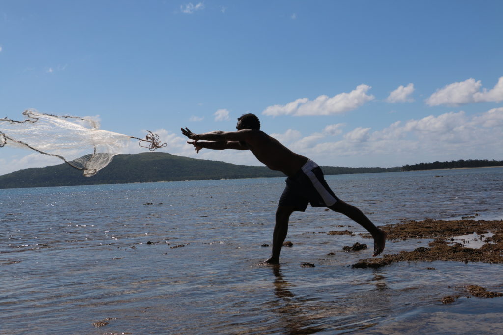 A fisherman casts his net in Vanuatu in the South Pacific, where locals are pressing for a ban on seabed mining. Photo: Caritas