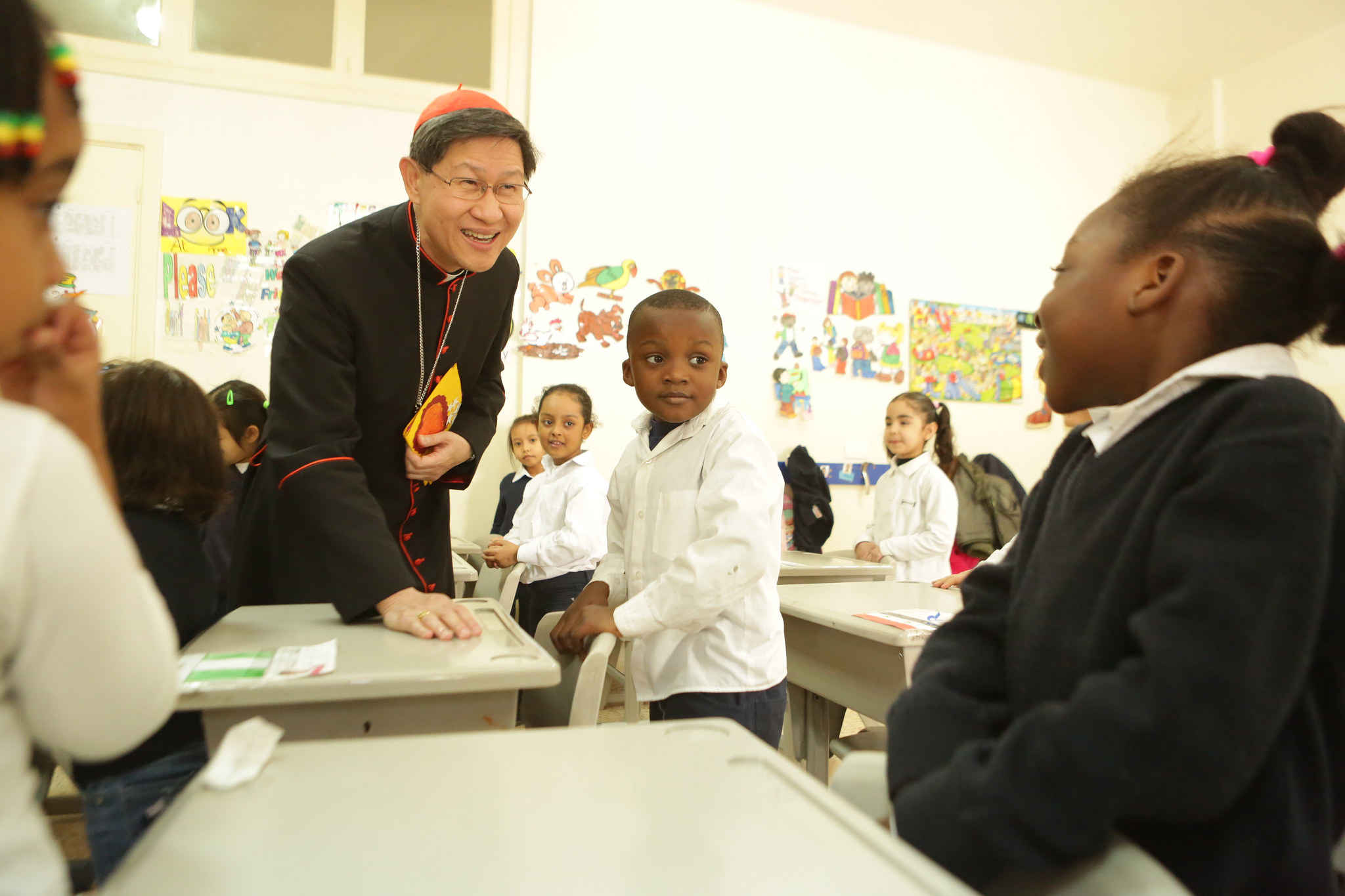 Cardinal Tagle met children at school for migrant workers and refugees in Lebanon in 2016.