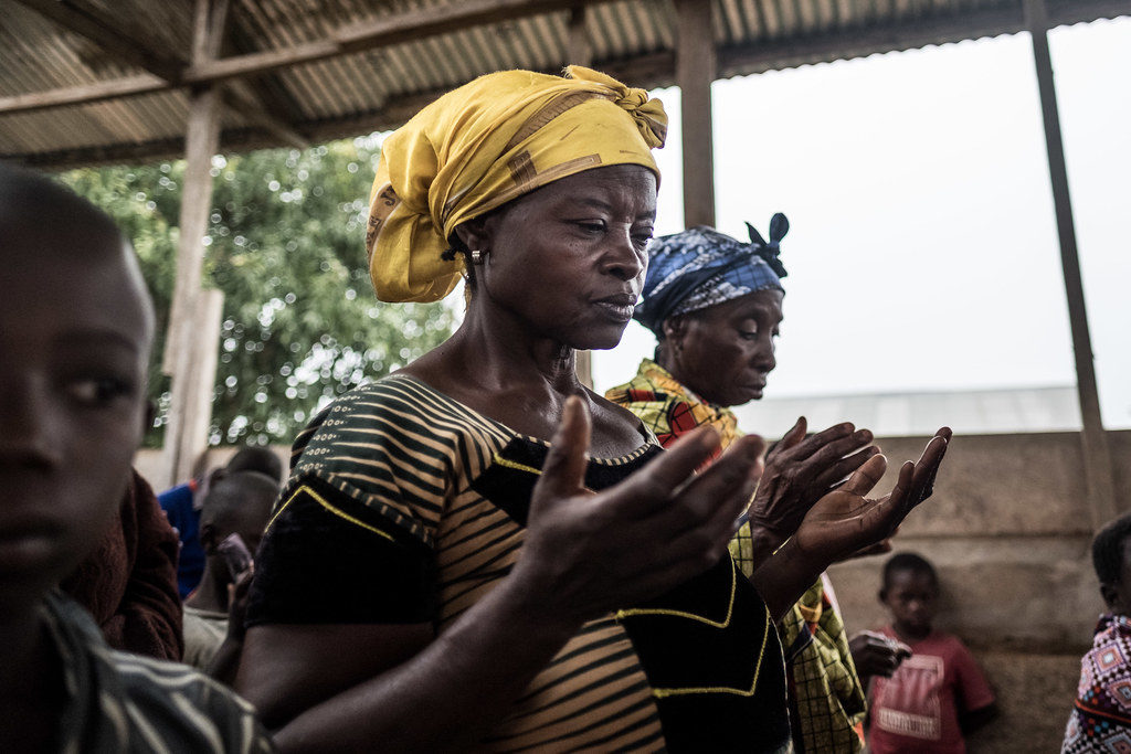 People pray before mass at a church service in the Ebola-hit town of Mambasa, DRC. 