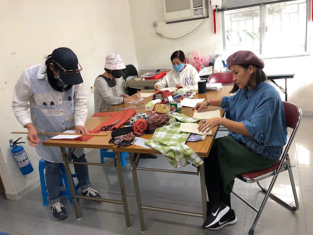 Volunteers from Caritas Hong Kong set up a project to design and sew cloth masks 