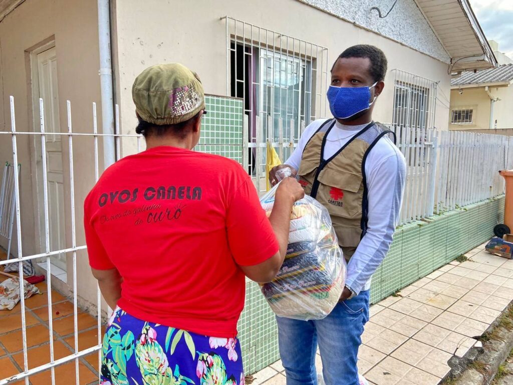 COVID-19 in Brazil: Caritas Brazil distributes food baskets containing rice, beans, sugar, flour, pasta, milk, eggs, oil and sardines to families. 