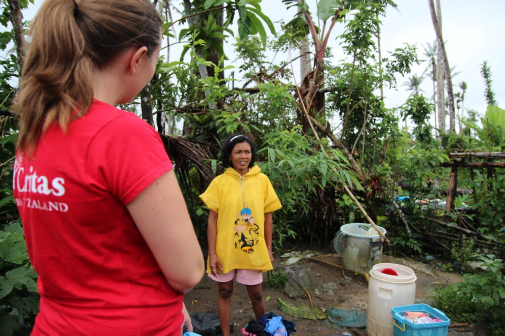 Anna Robertson, Caritas Aotearoa New Zealand discusses recovery with MaryJane in the diocese of Palo following Typhoon Haiyan